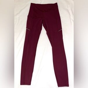 Maroon Lululemon leggings with pockets.